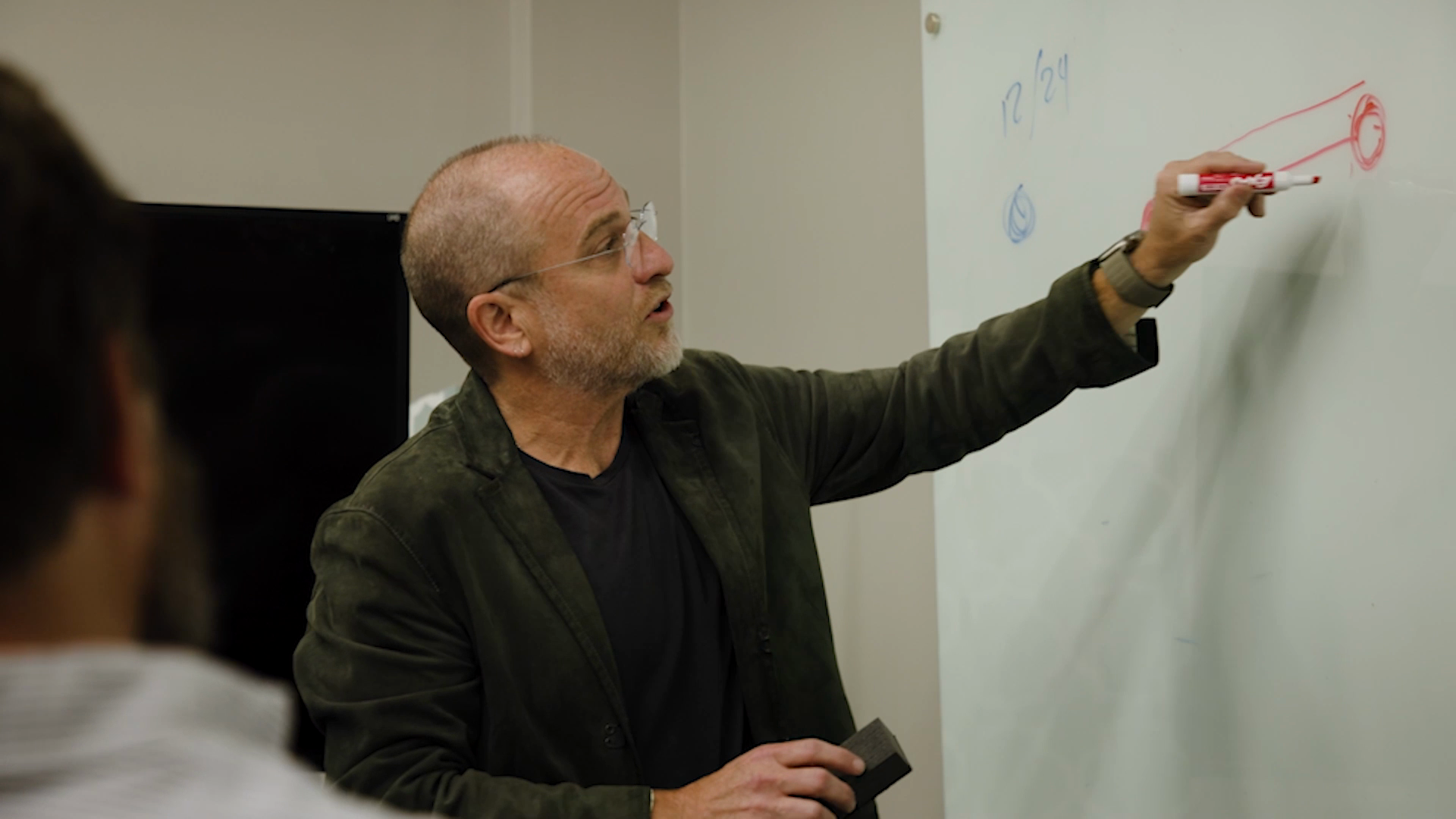 CEO, Jared drawing a diagram on a whiteboard.